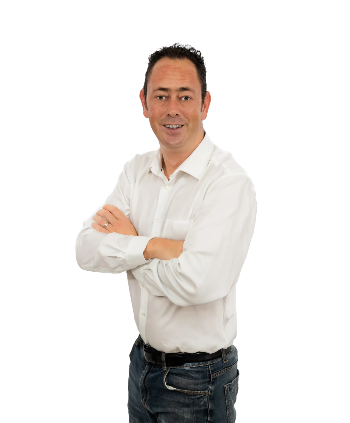 A person wearing a white button-down shirt and blue jeans, standing with arms crossed against a white background.