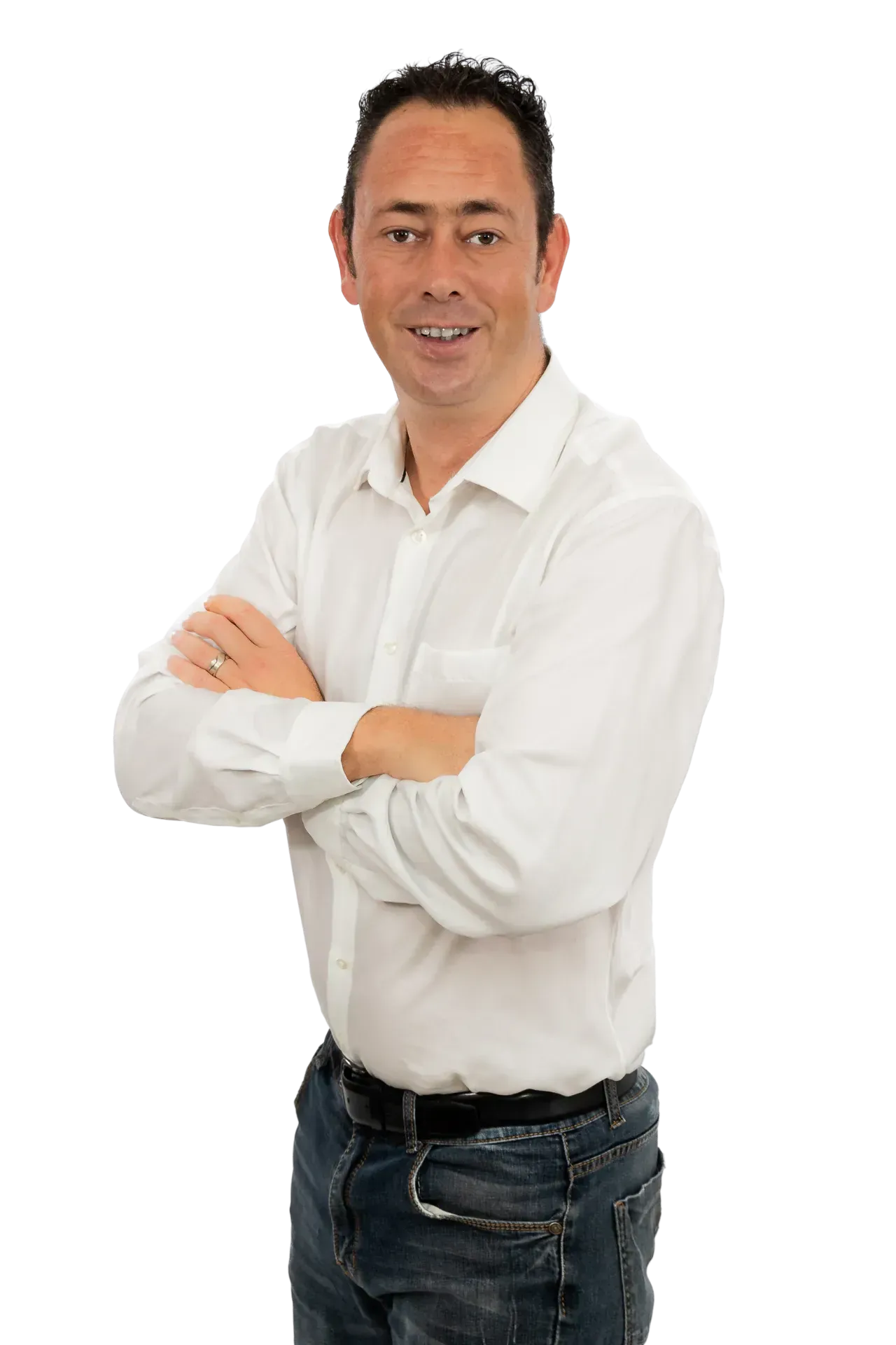 A person wearing a white button-down shirt and blue jeans, standing with arms crossed against a white background.