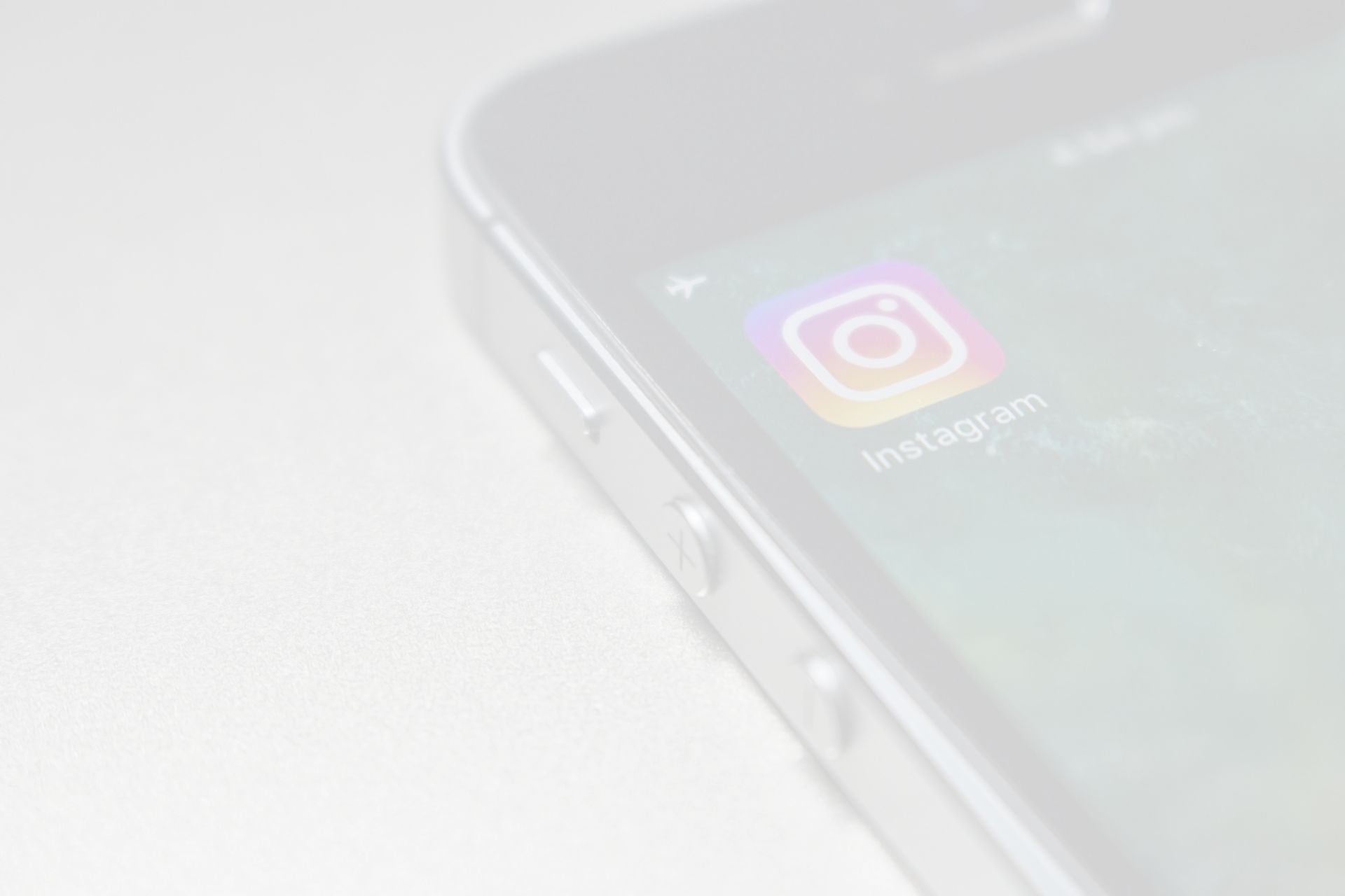 A close up of a cell phone with the instagram app on the screen.