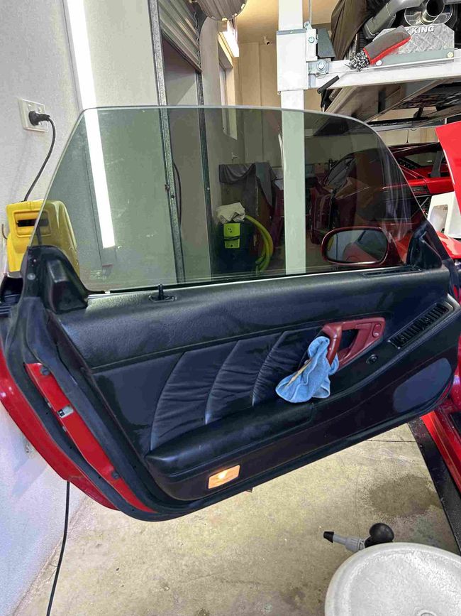 a technician using a heat gun to apply the rear windscreen with a ceramic window film in castle hill
