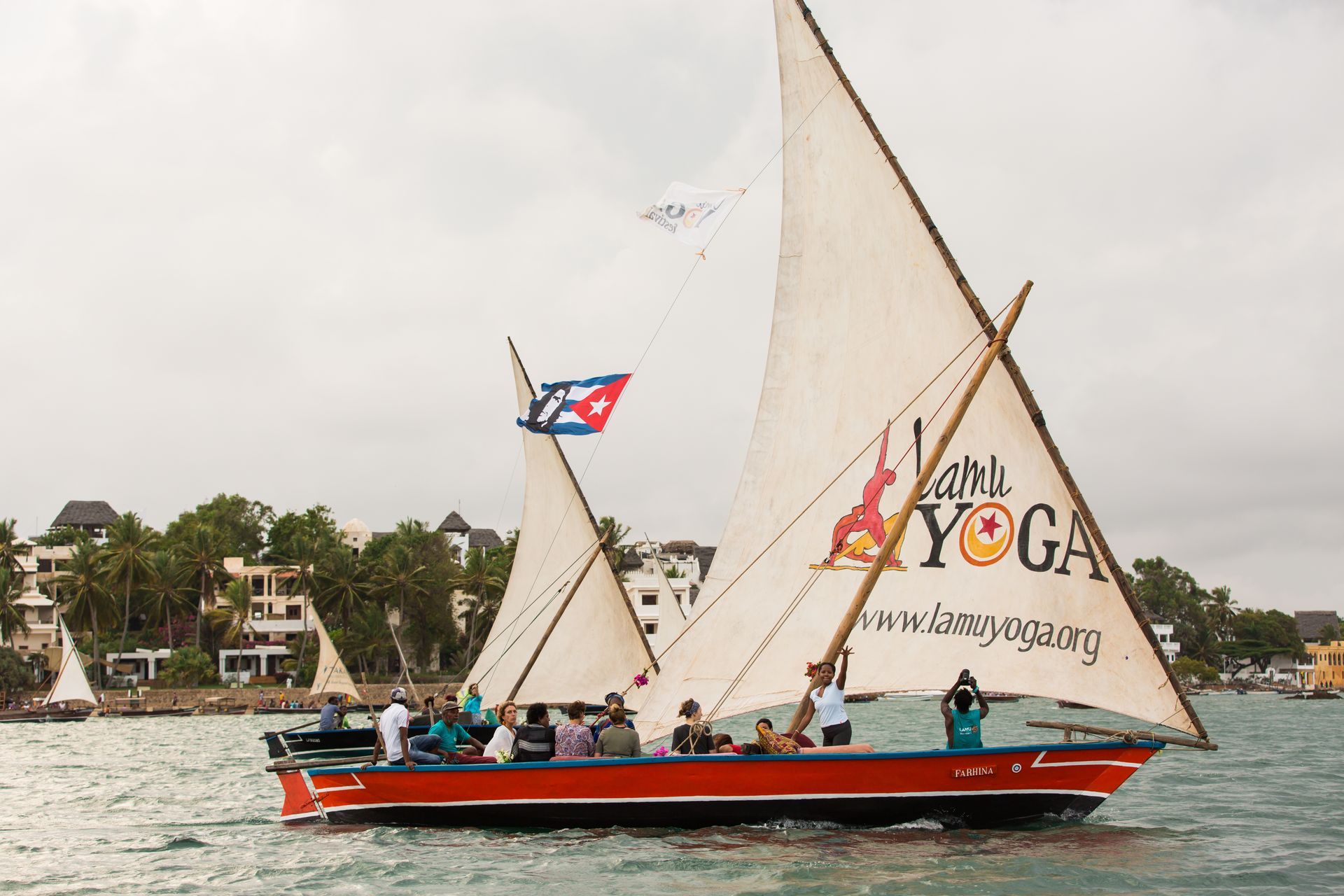 Traditional Swahili dhow sailing along the Lamu coastline, a classic ocean excursion available to guests staying in Lamu