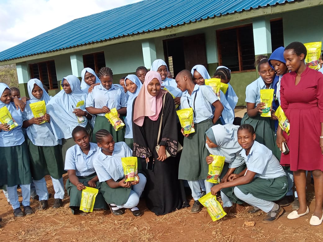 Girls receiving reusable pads at school in Lamu