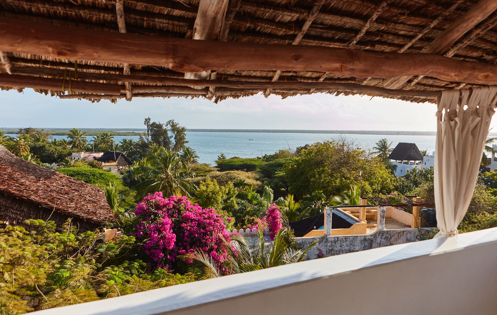 Penthouse balcony with ocean view at Banana House