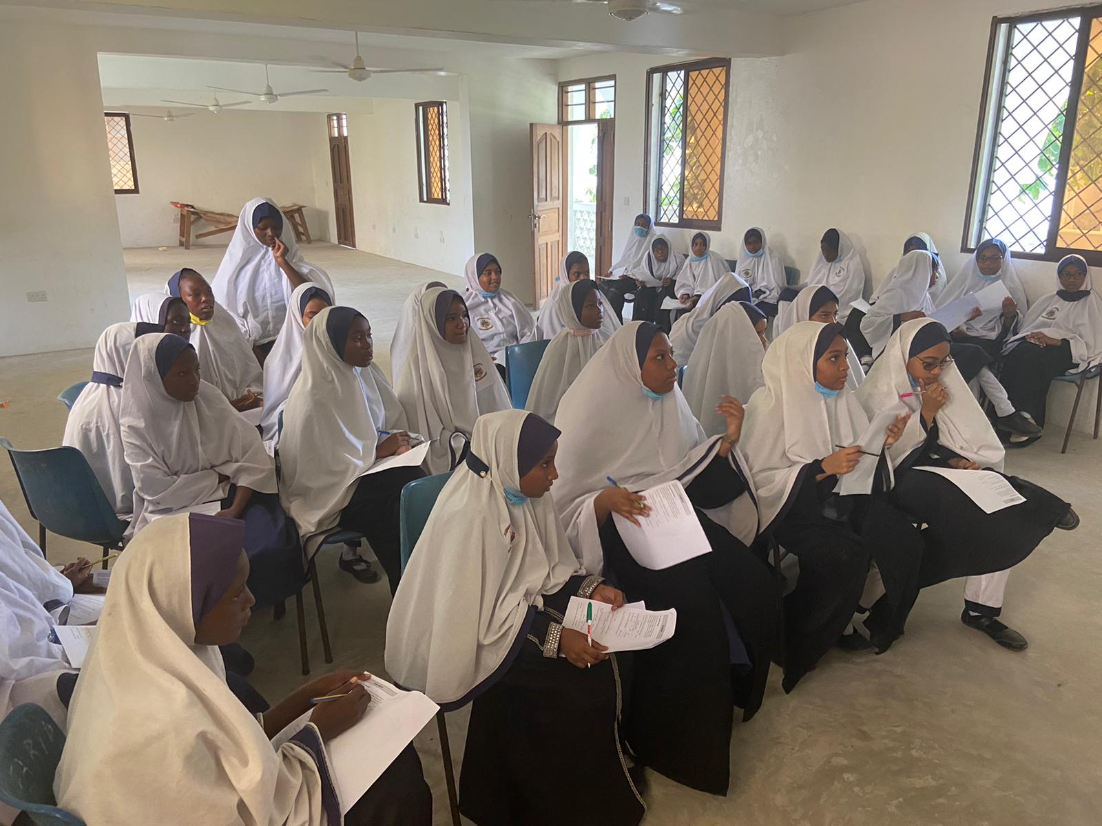 Students attending a community education session in Shela, Lamu
