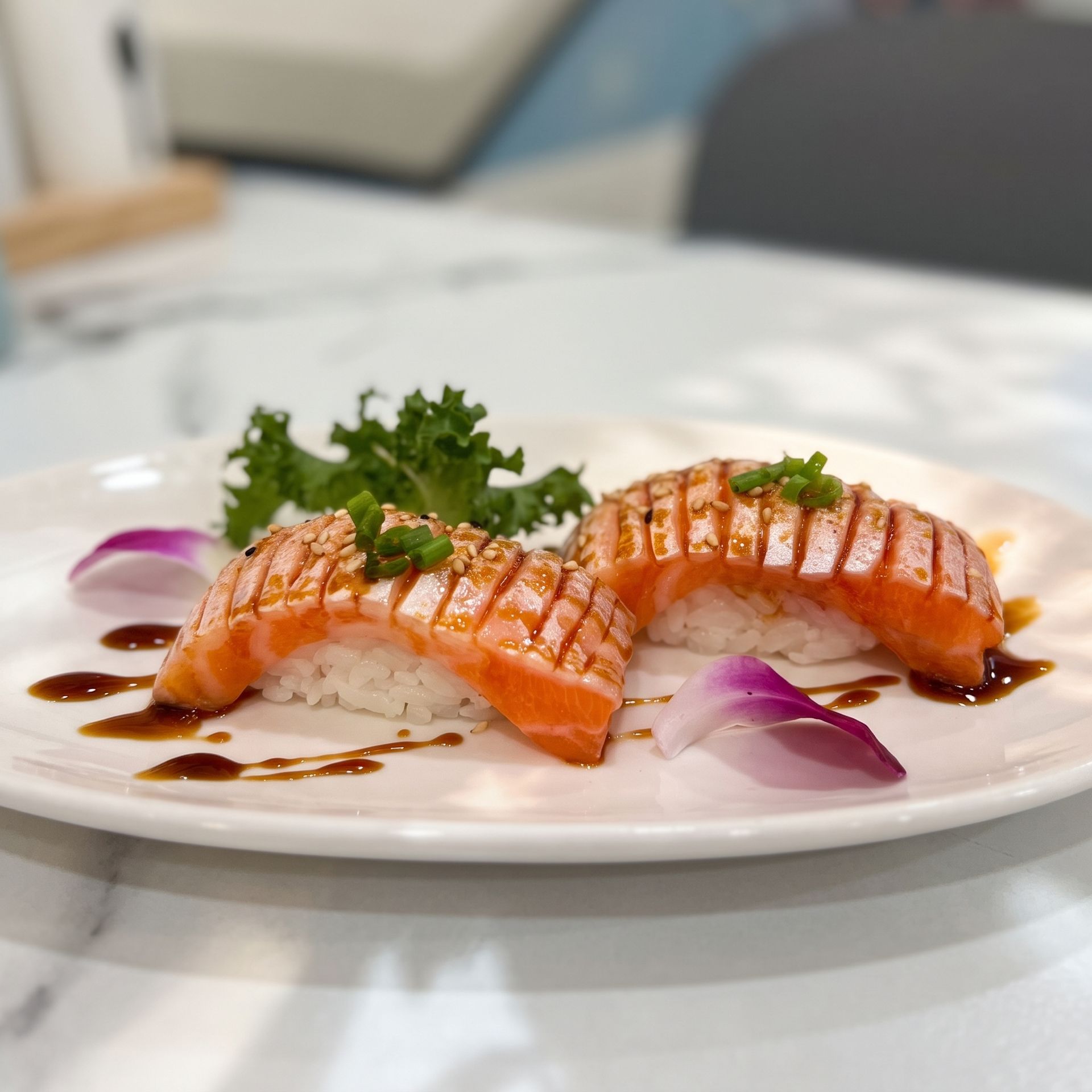 Plated grilled salmon with sauce and herbs on a white restaurant table