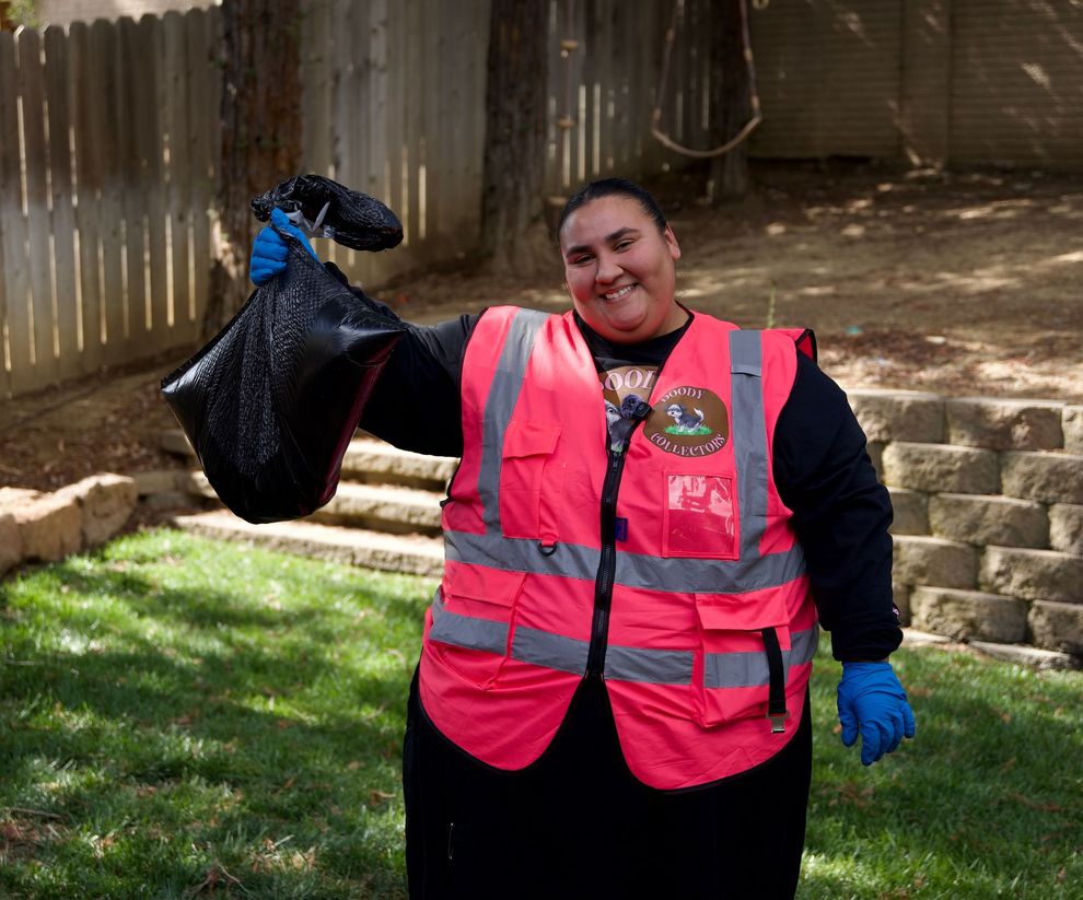 Doody Collectors local pet waste removal team member with dog