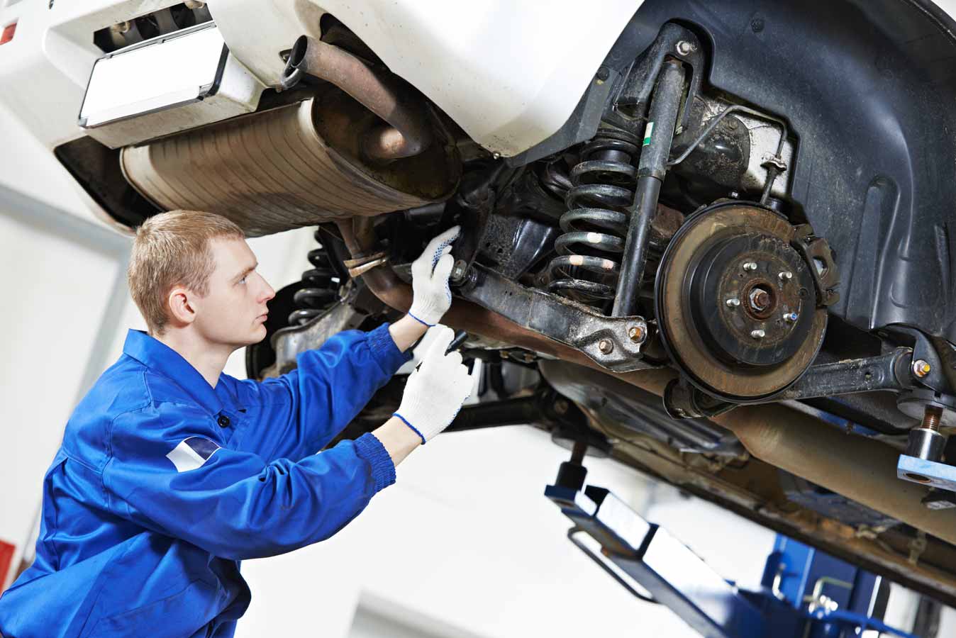Man Checking Car Suspension — Mechanical Services in Coolum Beach, QLD