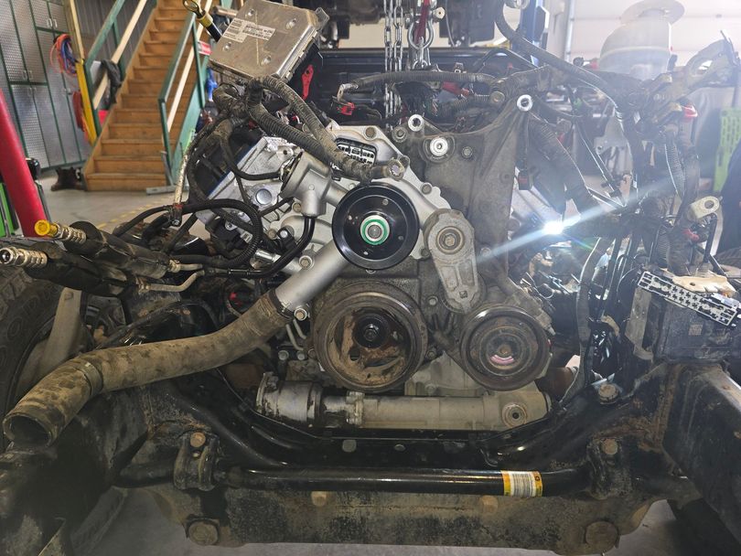 Technician working on engine repair
