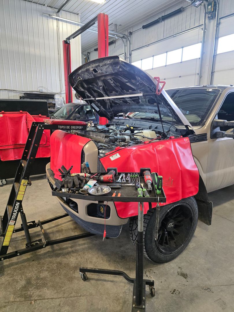 Technician connecting OBD diagnostic scanner