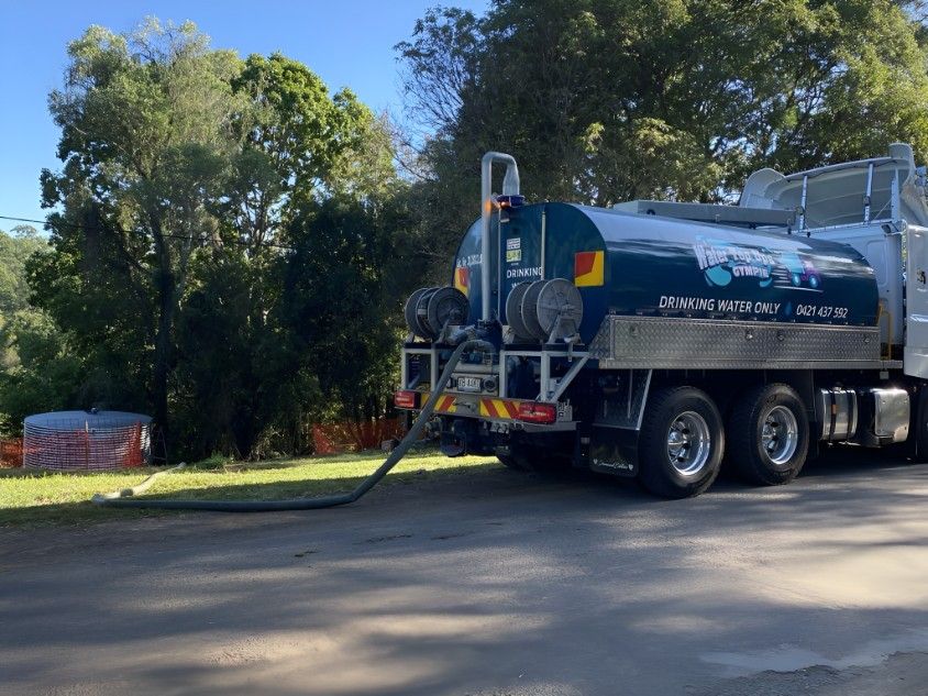 A Large Tanker Truck is Parked on the Side of the Road — Water TopUps Gympie in Curra, QLD