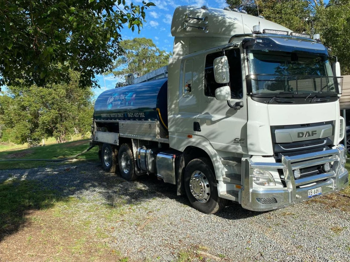 Blue and White Daf Tanker Truck Parked on A Gravel Lane by Trees — Water Top Ups Gympie in Jones Hill, QLD