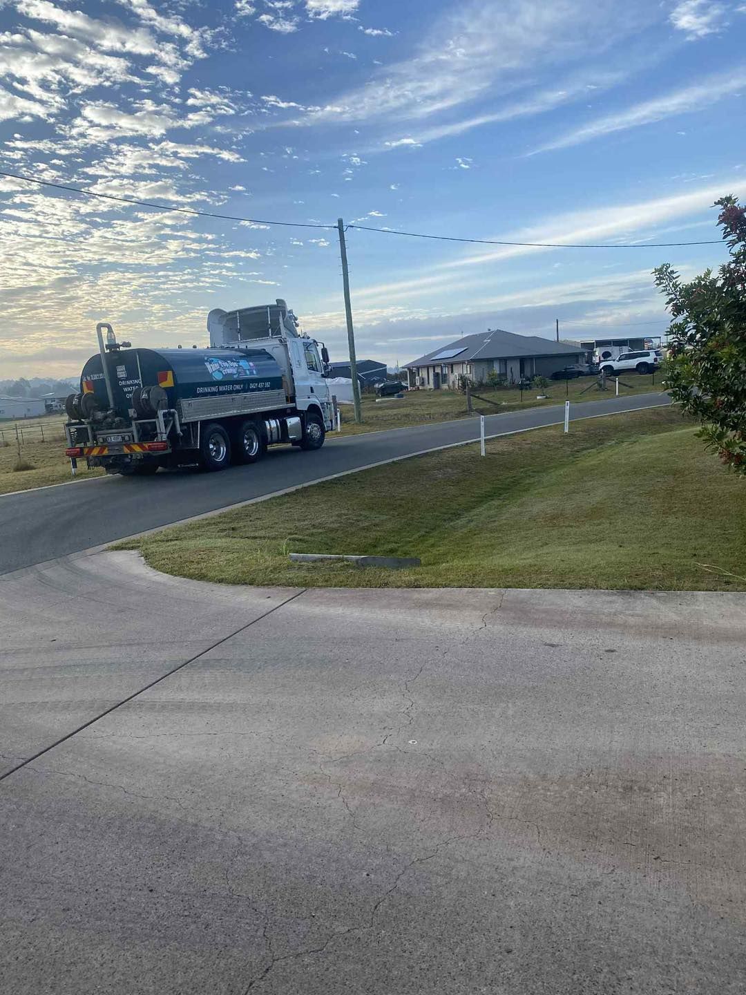 Water Truck on a Residential Street — Water TopUps Gympie in Araluen, QLD