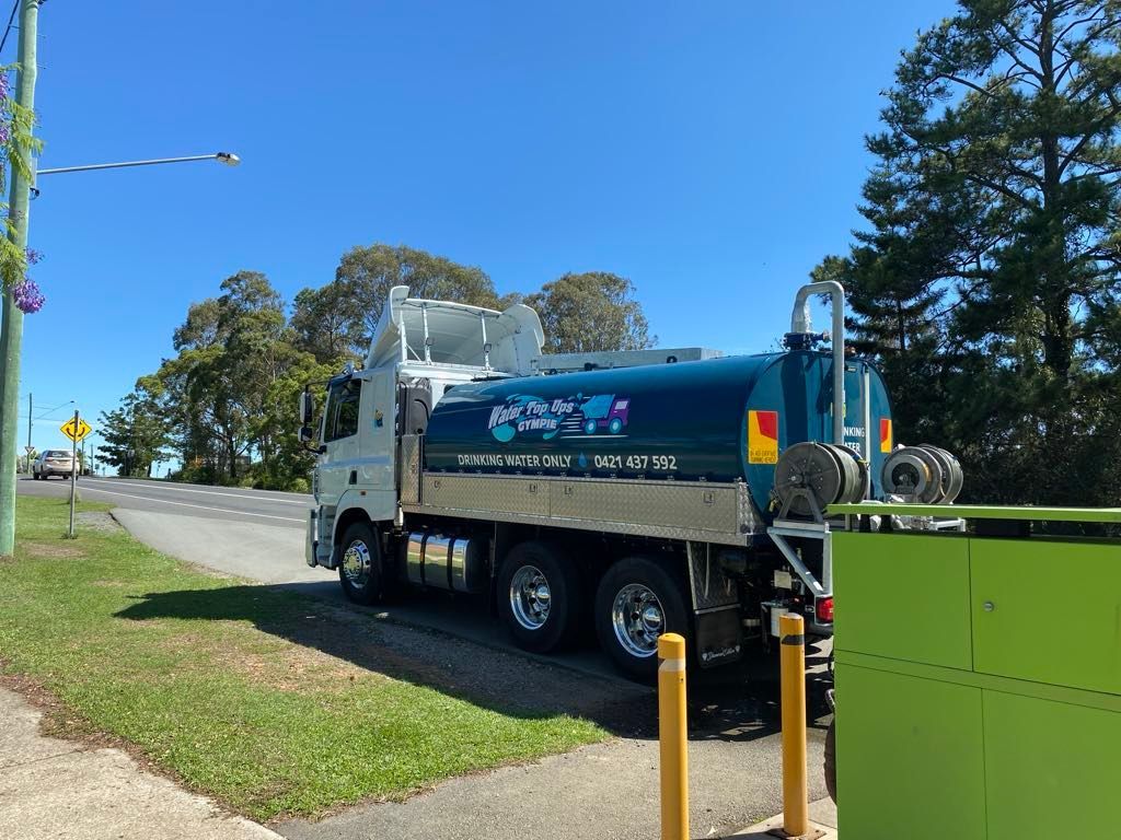 A Truck is Parked on the Side of the Road Next to a Sidewalk — Water TopUps Gympie in Curra, QLD