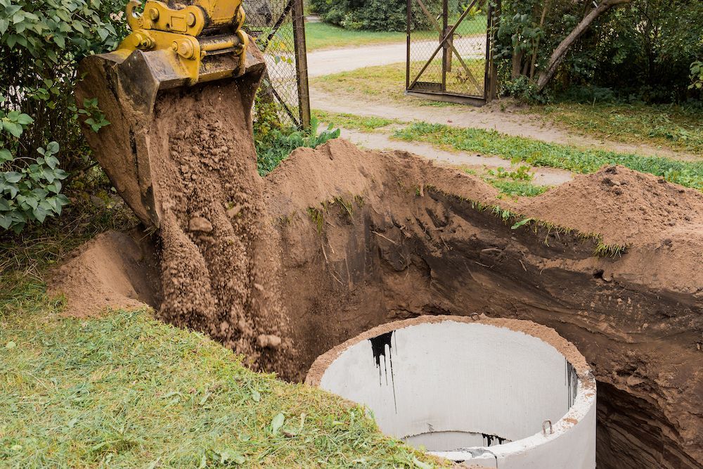 A Bulldozer is Digging a Hole for a Septic Tank — Water TopUps Gympie in Curra, QLD