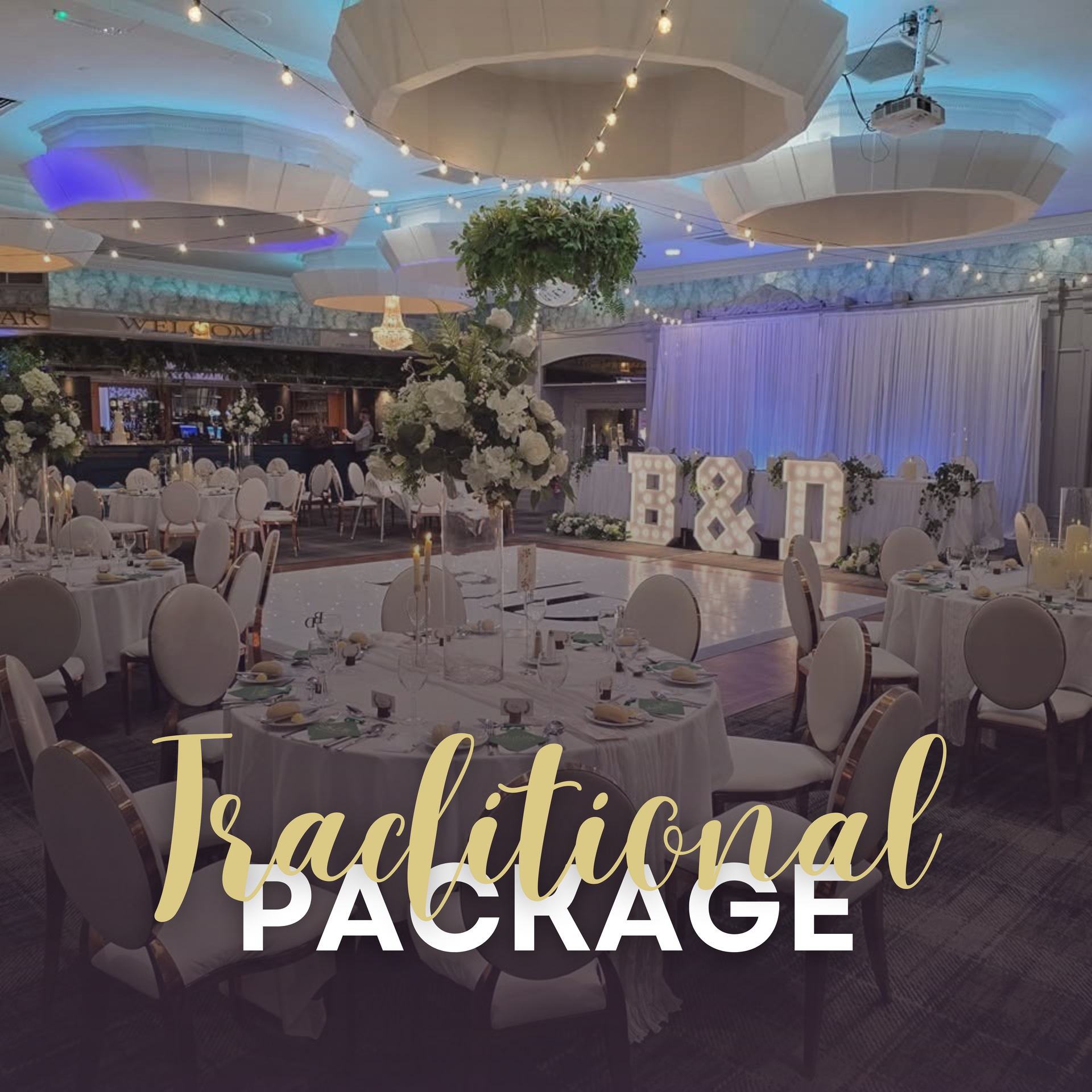 Elegant banquet hall with white table settings, draped lights, and “Traditional Package” text overlay