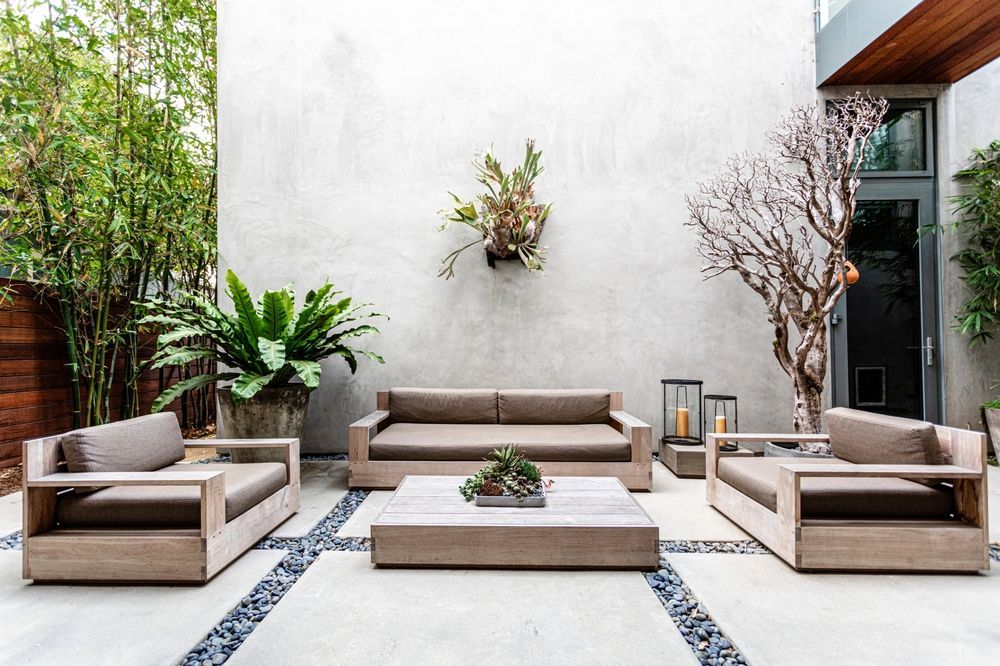 Outdoor Seating Area With Gray Sofa, Armchairs, and Coffee Table — Precision Fencing & Landscaping in Thurgoona, NSW