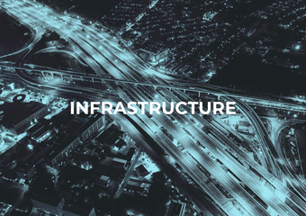 Aerial view of a city highway interchange at night with the word 