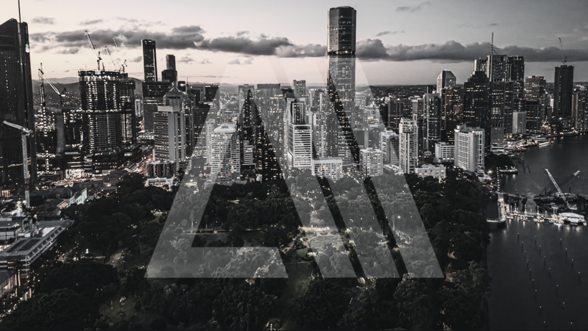 City skyline at dusk with the letters