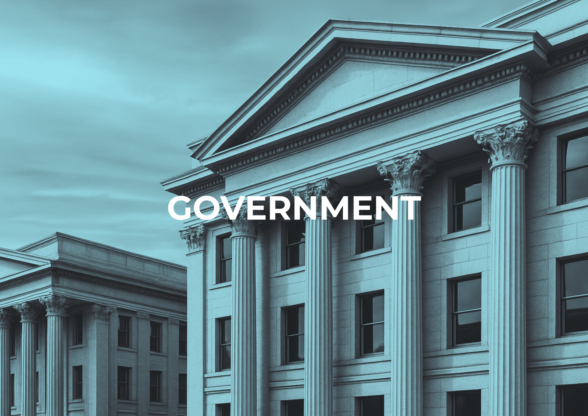 Government building with columns, in teal with the word 