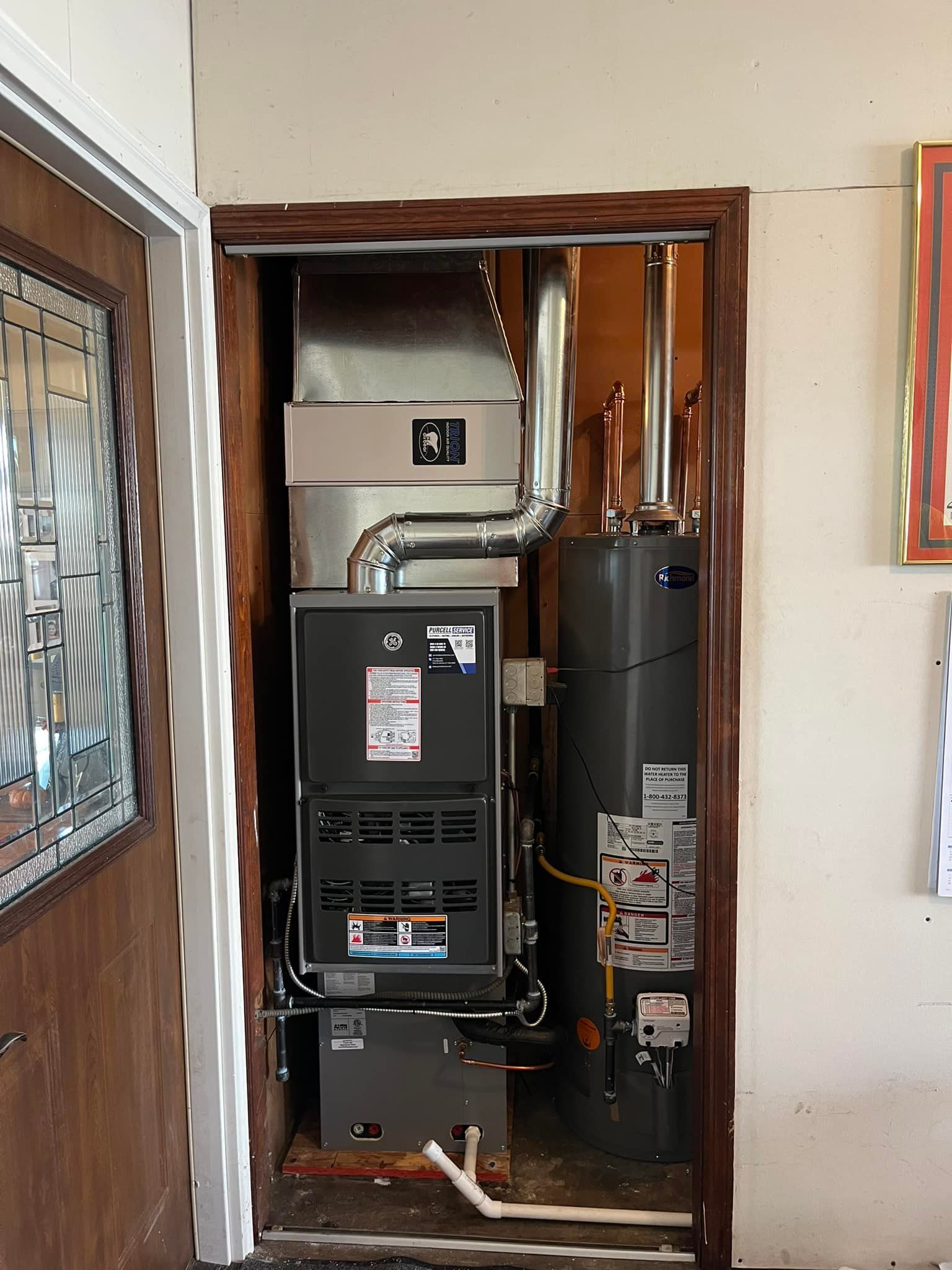 A room with a heater and a water heater in it
