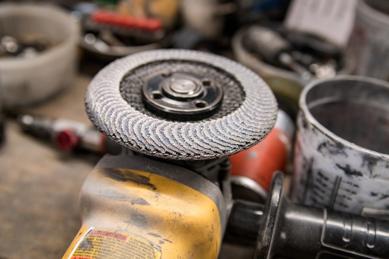 A close up of a grinder sitting on top of a table.
