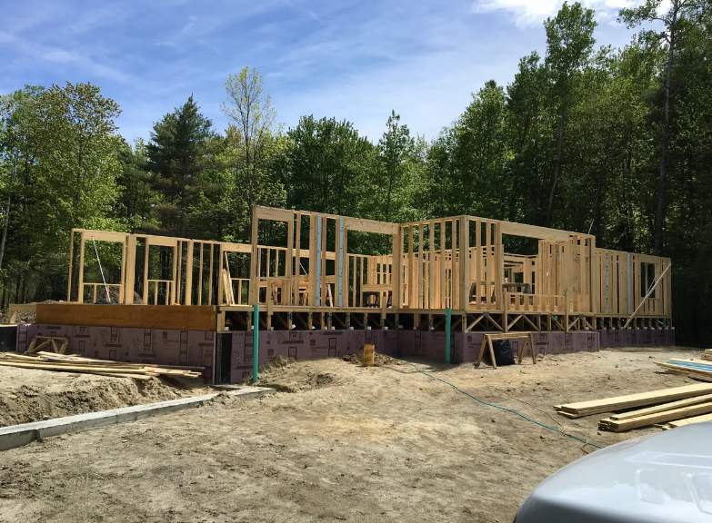 A house is being built in the middle of a forest.