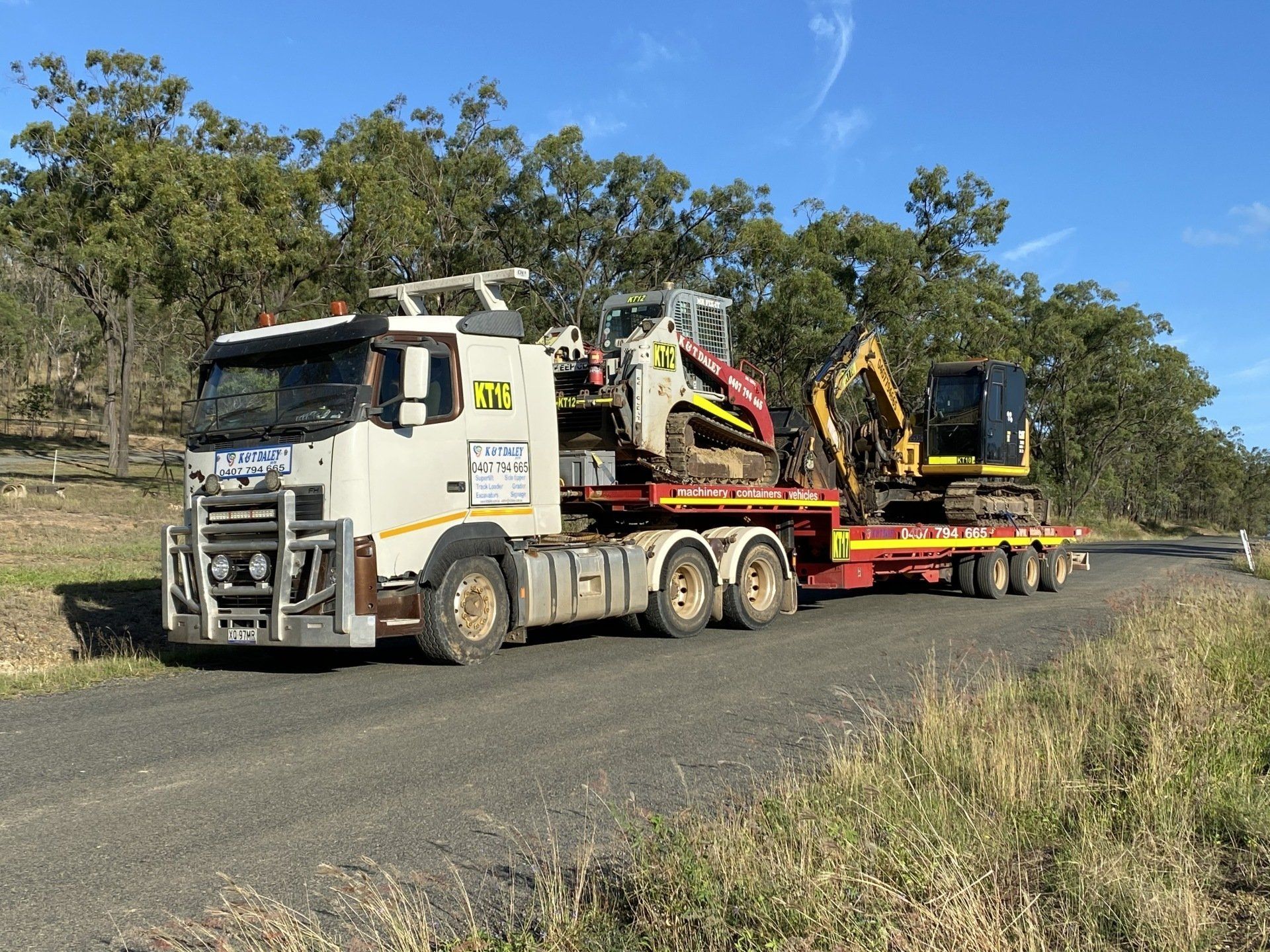 Truck Carrying Diggers — Earthmoving Near Me in Australia