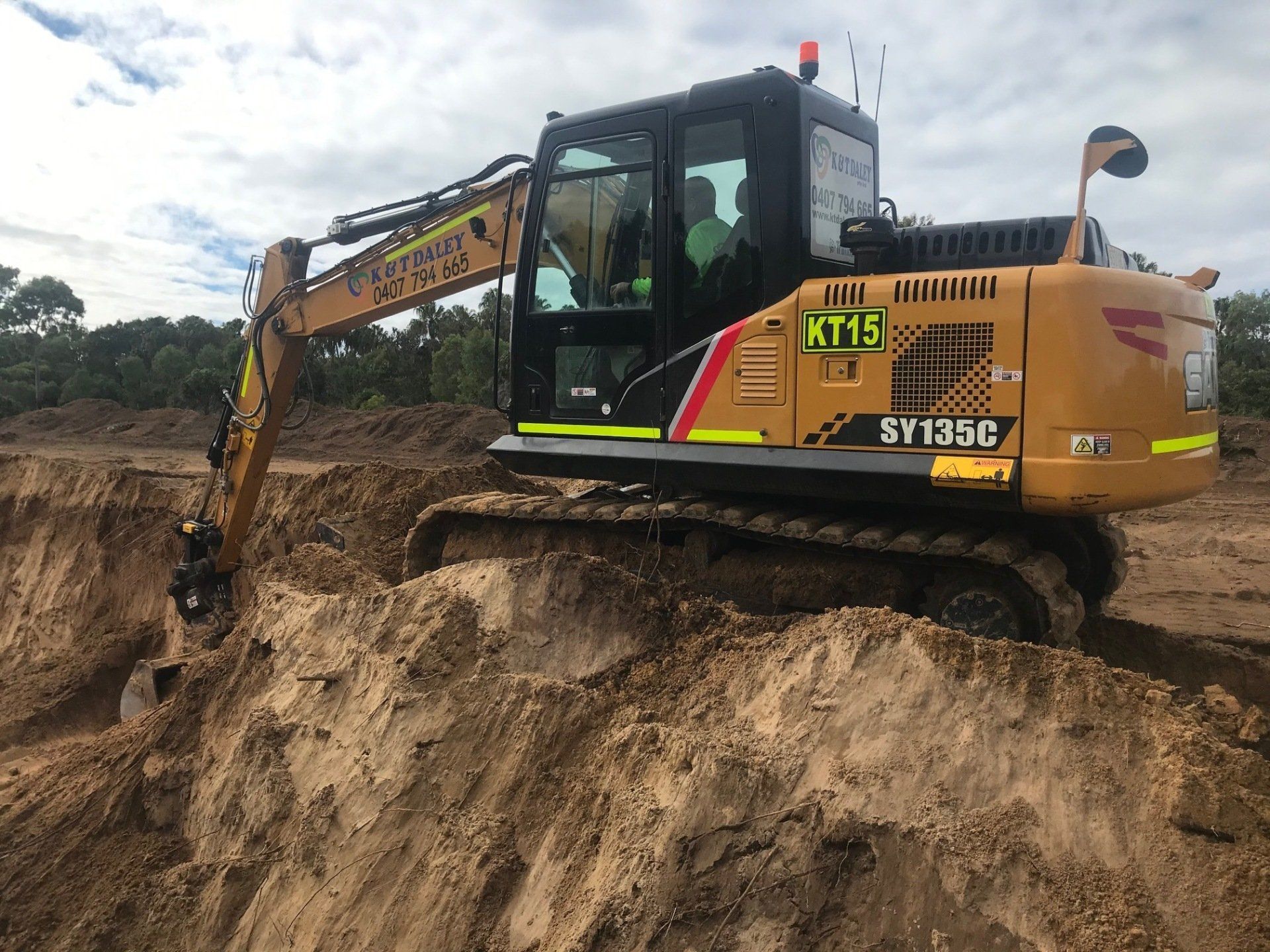 Wheel Loader Excavator Working On Construction Site — K & T Daley in Yeppoon, QLD