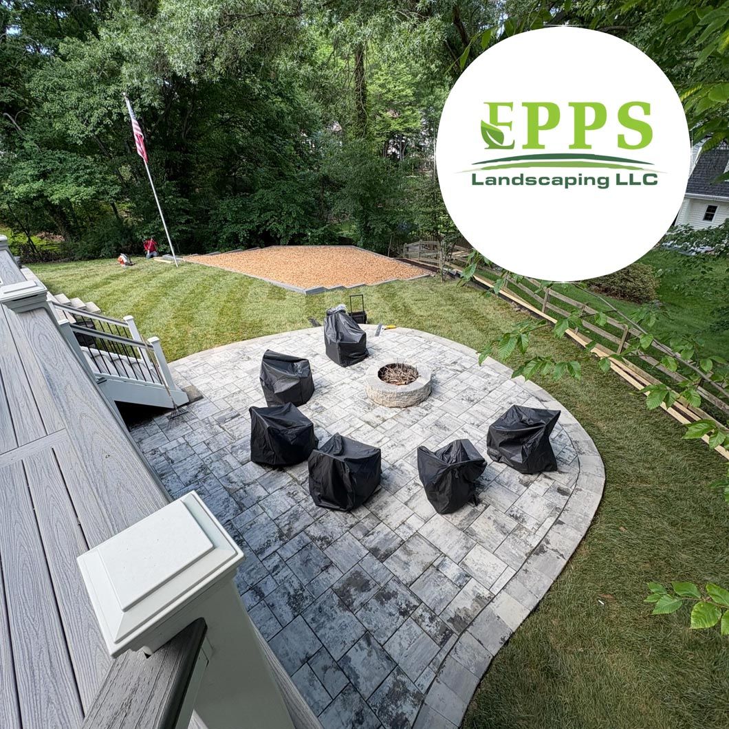 Backyard patio with stone fire pit seating area and landscaped lawn, EPPS Landscaping & Lawn logo overlay