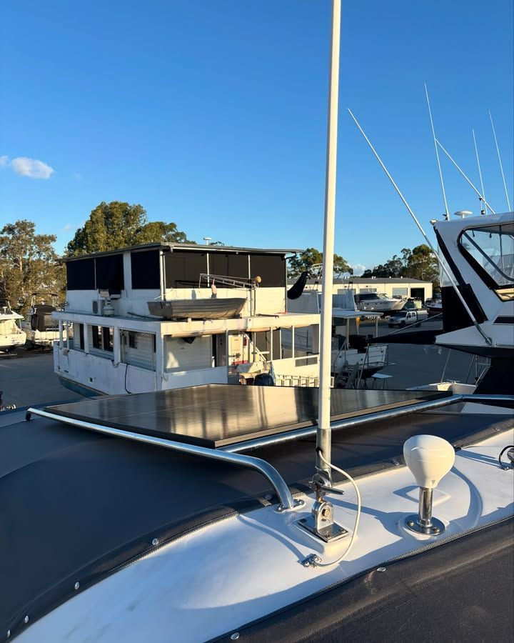 White Boat With Solar Panels and Antenna — Master Metals Fabrication in Labrador, QLD