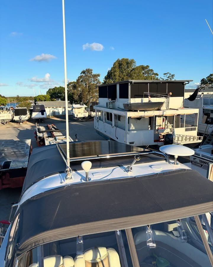 Boat Rooftop With Antenna, Looking at Other Boats in a Boatyard on a Sunny Day — Master Metals Fabrication in Labrador, QLD