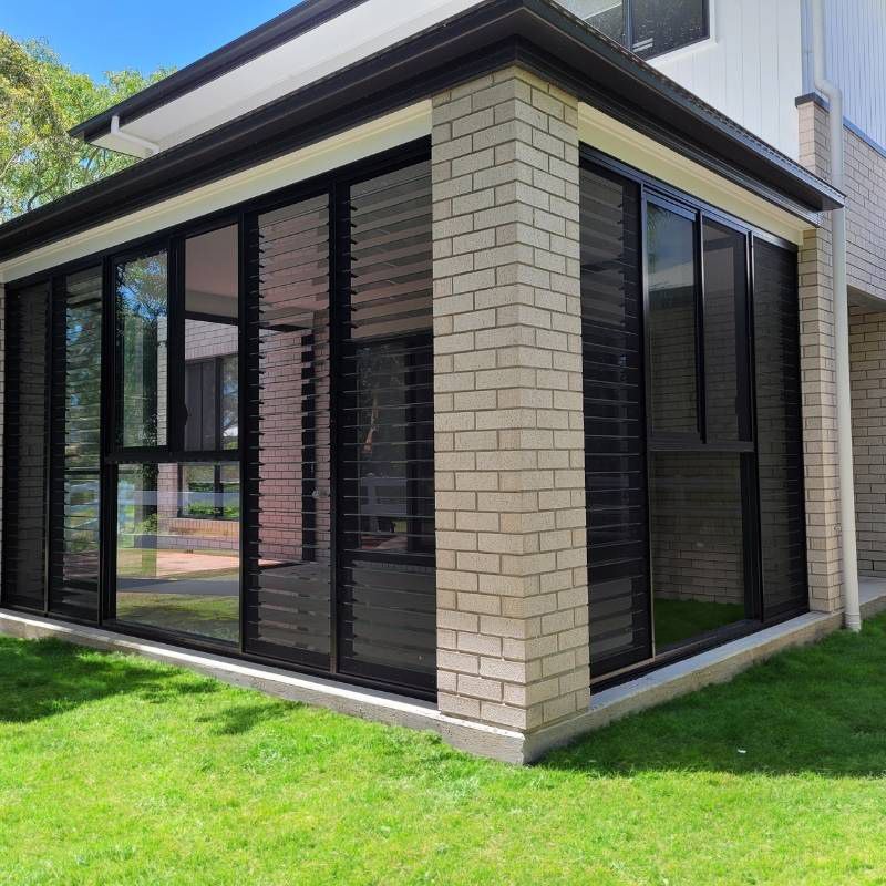 Glass Louvre Window And Green Glass — Experienced Builder in Bowen, QLD