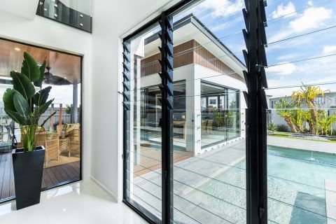 Stylish Black Framed Jalousie Window For Contemporary Homes — Experienced Builder in Collinsville, QLD