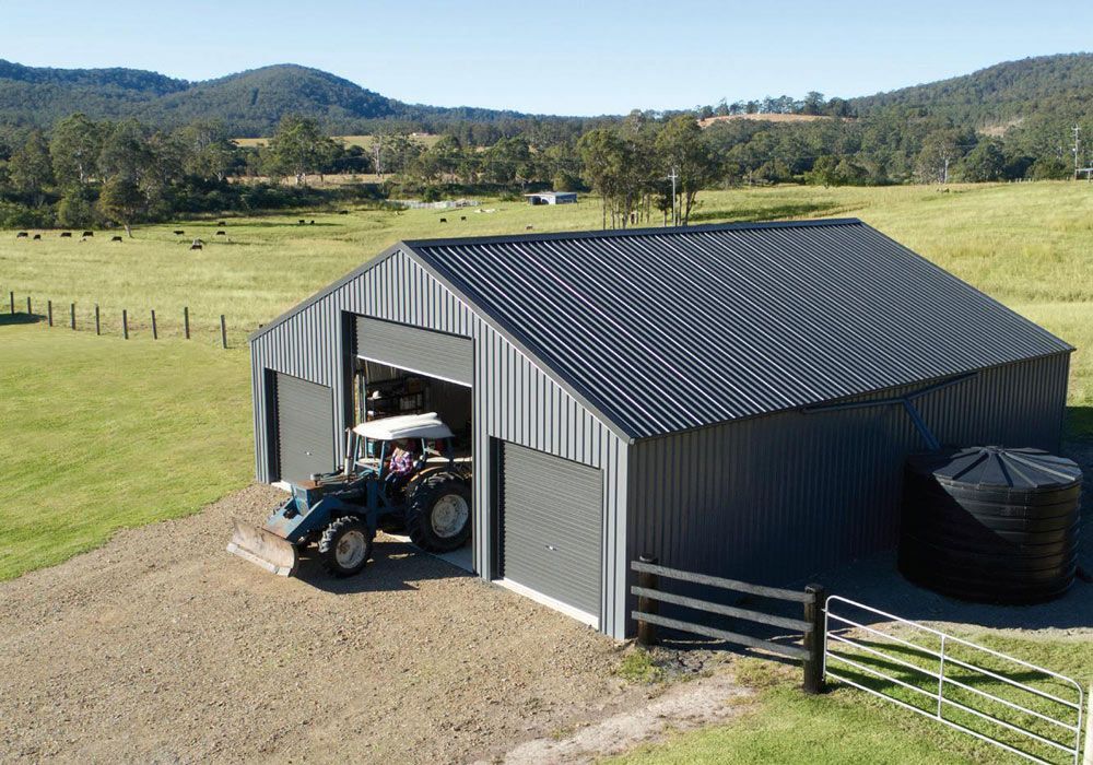 Tractor Going Out Of Shed Ready To Work — Experienced Builder in Bowen, QLD