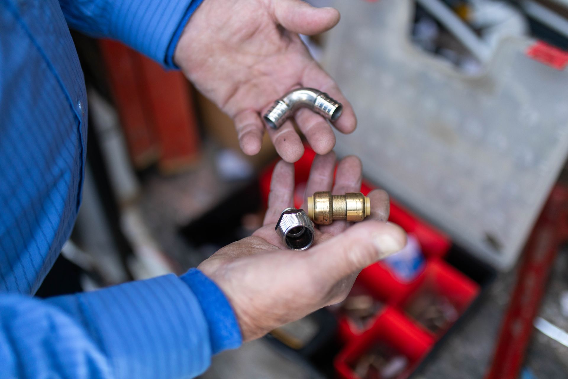 Man holding plumbing fixtures