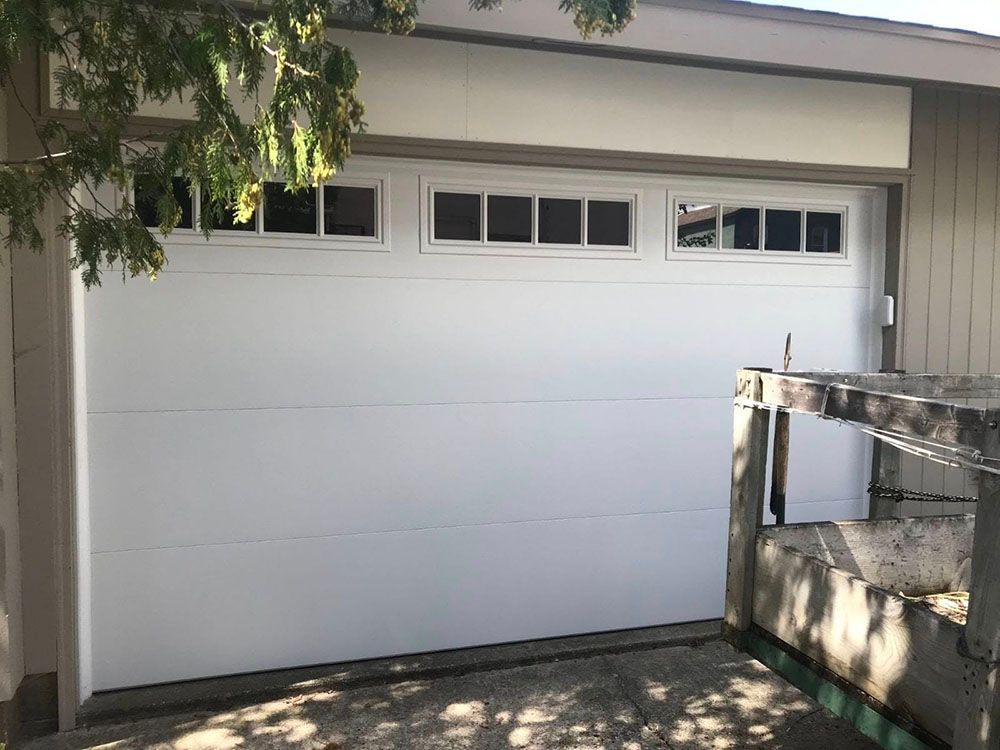 White garage door with small windows 