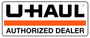 U-Haul Authorized Dealer sign with black logo and orange stripe on white background