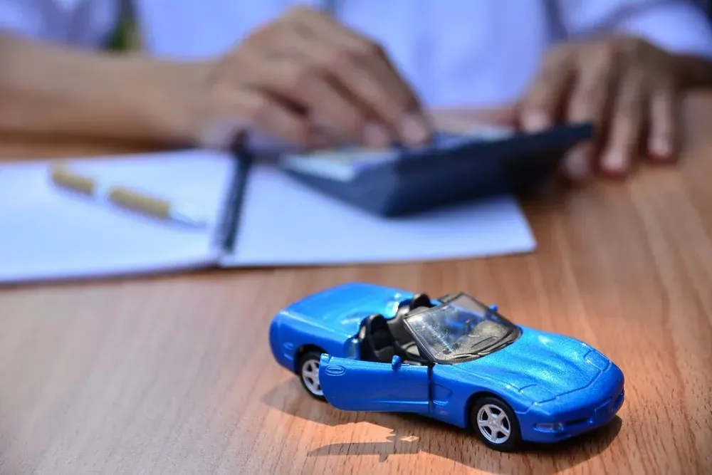 Blue Toy Car With Open Door Sits on a Table — Coastal Collision Repairs in Buderim, QLD