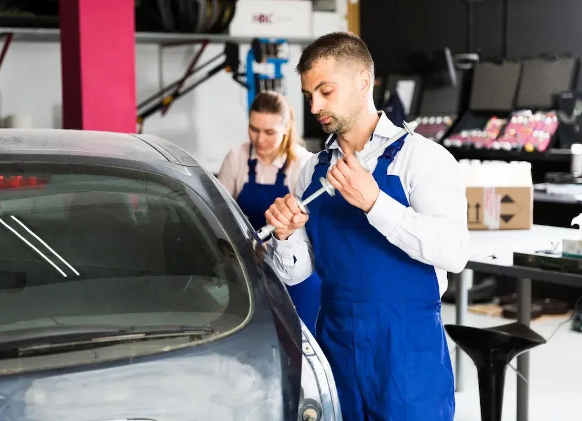 Mechanic Performing Dent Repair On The Sunshine Coast