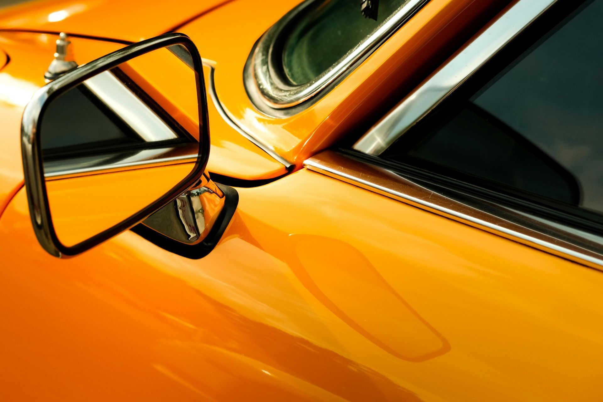 Close-up of a Bright Orange Vintage Car's Side Mirror — Coastal Collision Repairs in Buderim, QLD