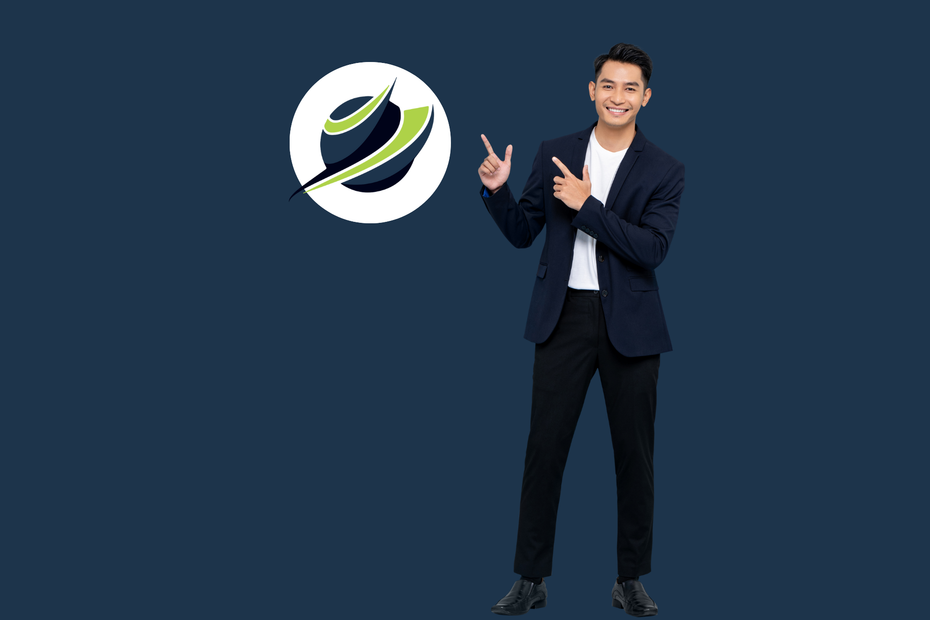 A man in a suit is standing in front of a logo and pointing at it.