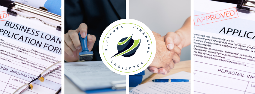 A person is applying for a business loan and shaking hands.