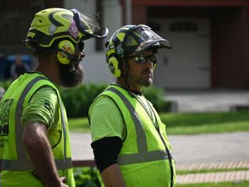 Oli outdoor crew members working on tree service job