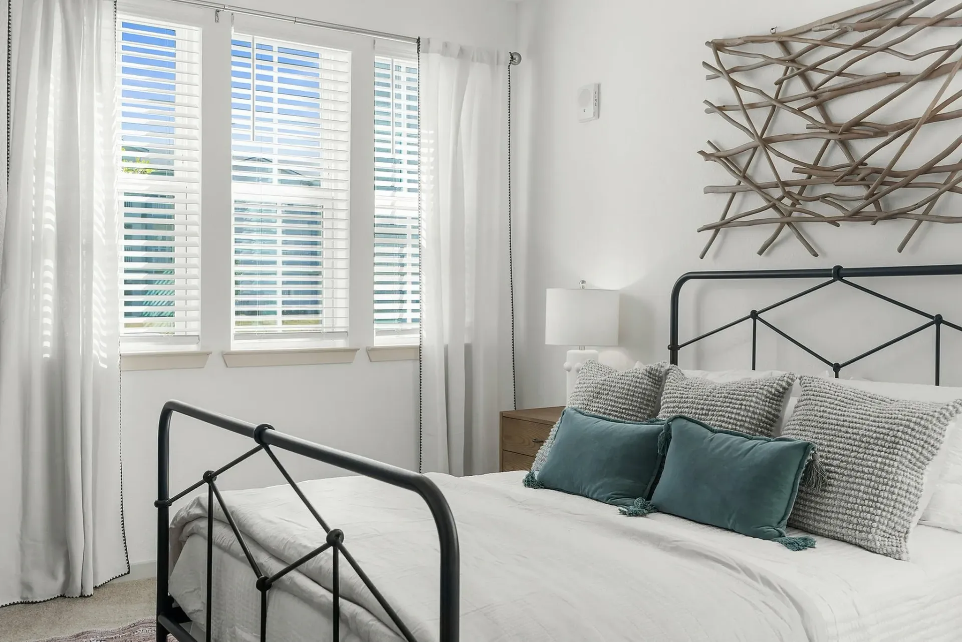 Experience relaxation in this beautifully sunlit bedroom.