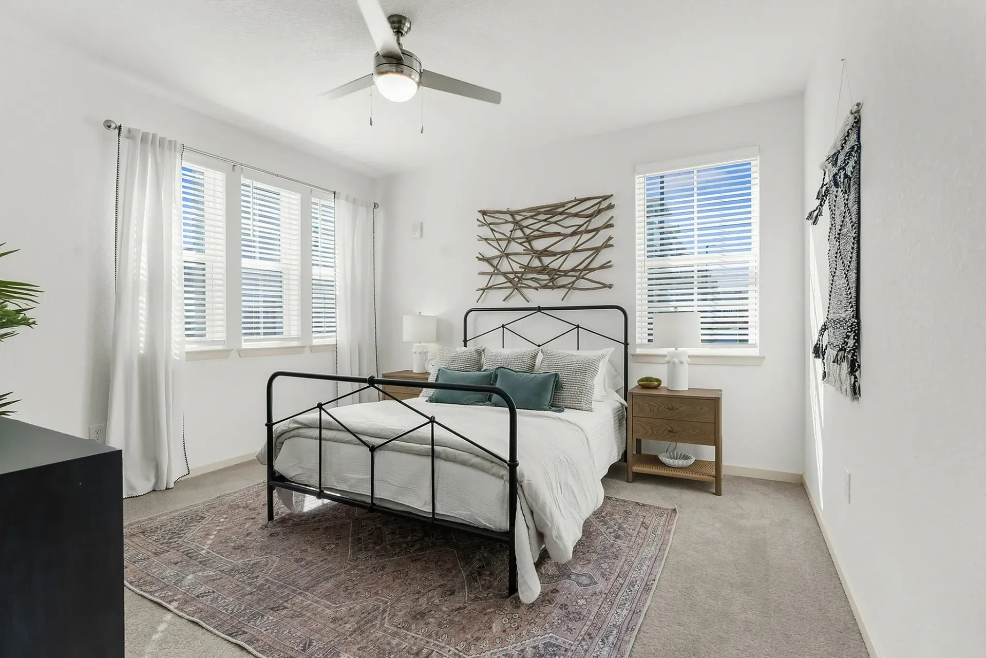 Embrace tranquility in this elegantly designed bedroom filled with natural light.