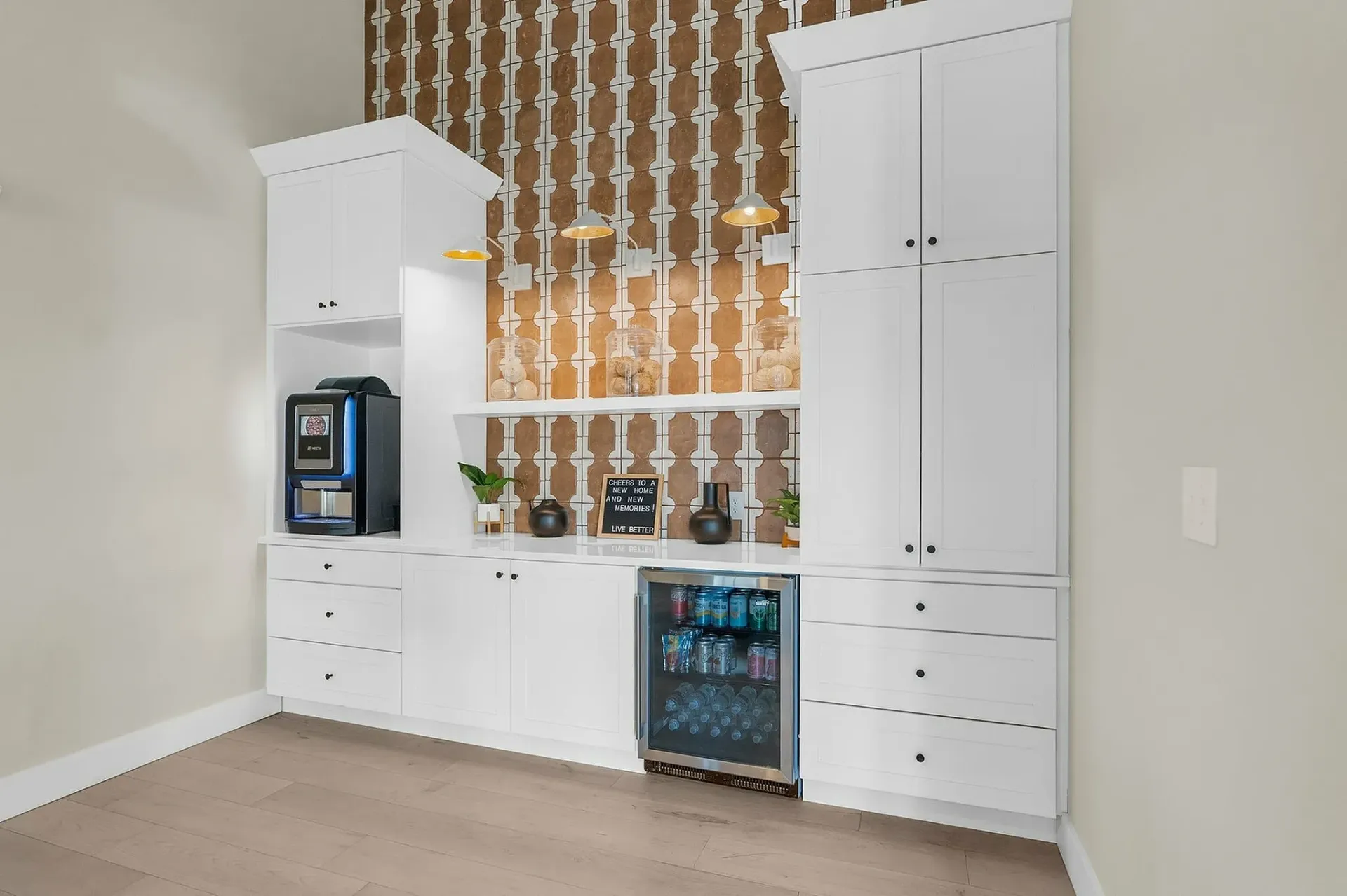 Explore this chic kitchenette designed for ease and style, featuring sleek storage and modern amenities.
