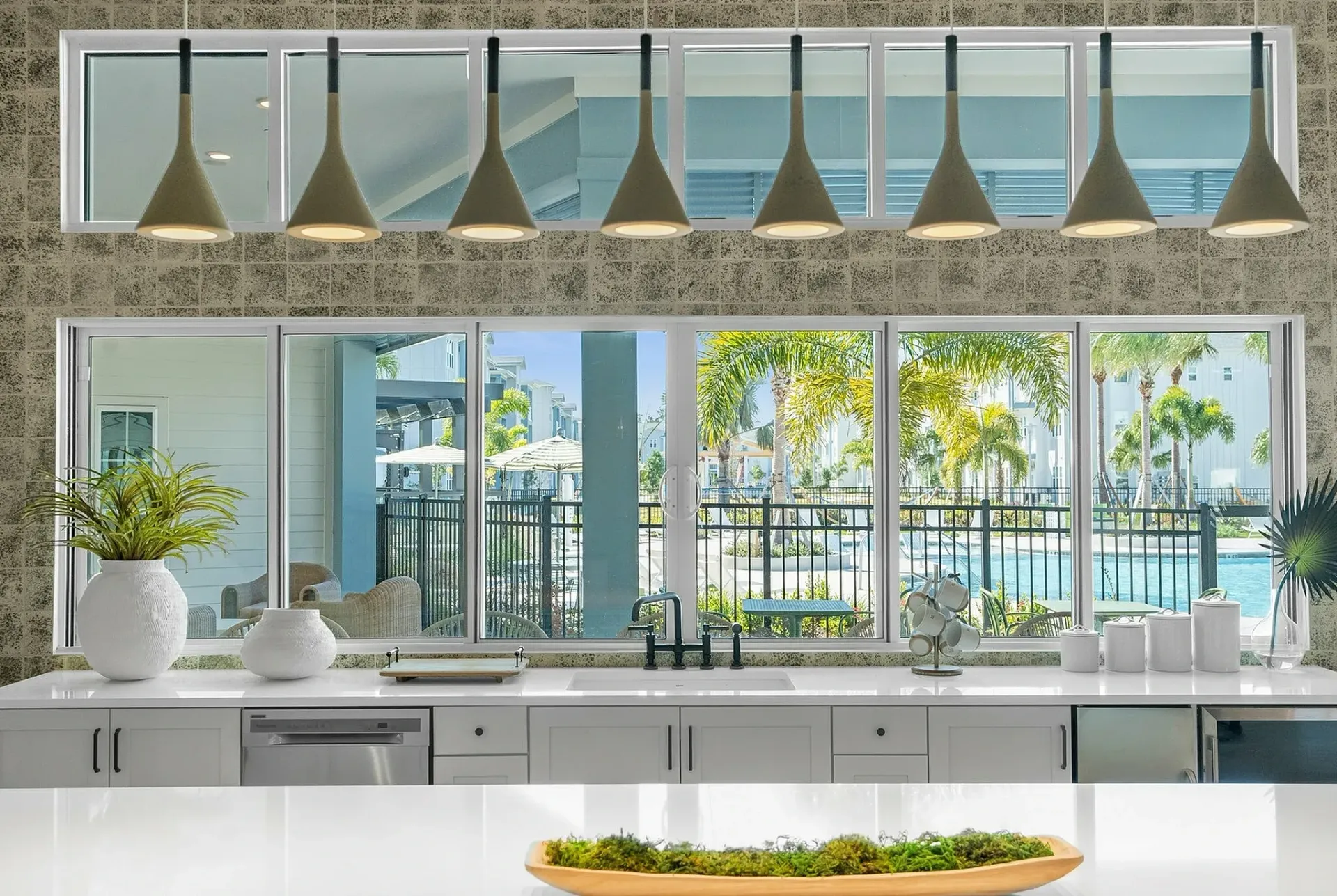 Experience culinary delight with a stunning poolside view that brings nature into your kitchen.