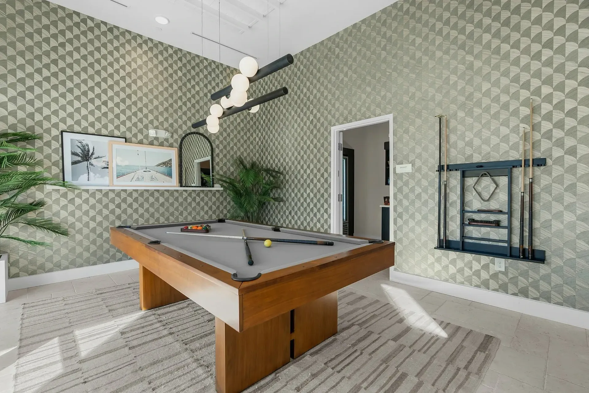 Experience leisure in style with this modern game room, blending elegance and functionality.
