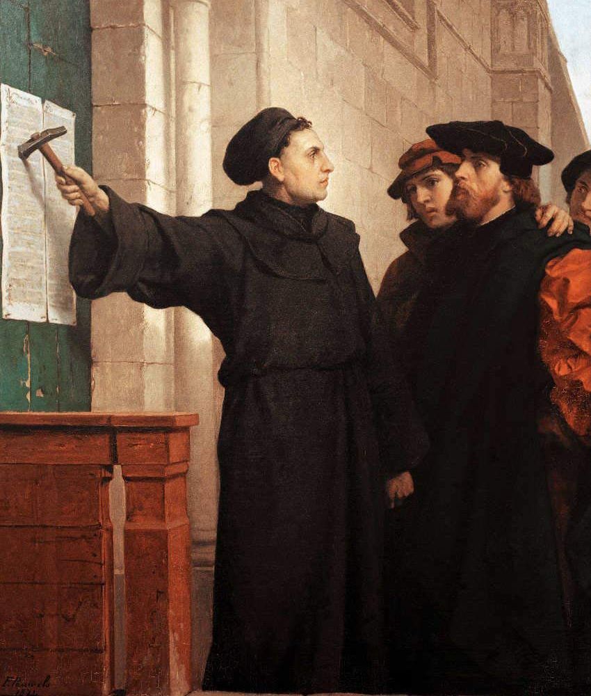 Martin Luther hammering his 95 Theses to a church door in Wittenberg, Germany.