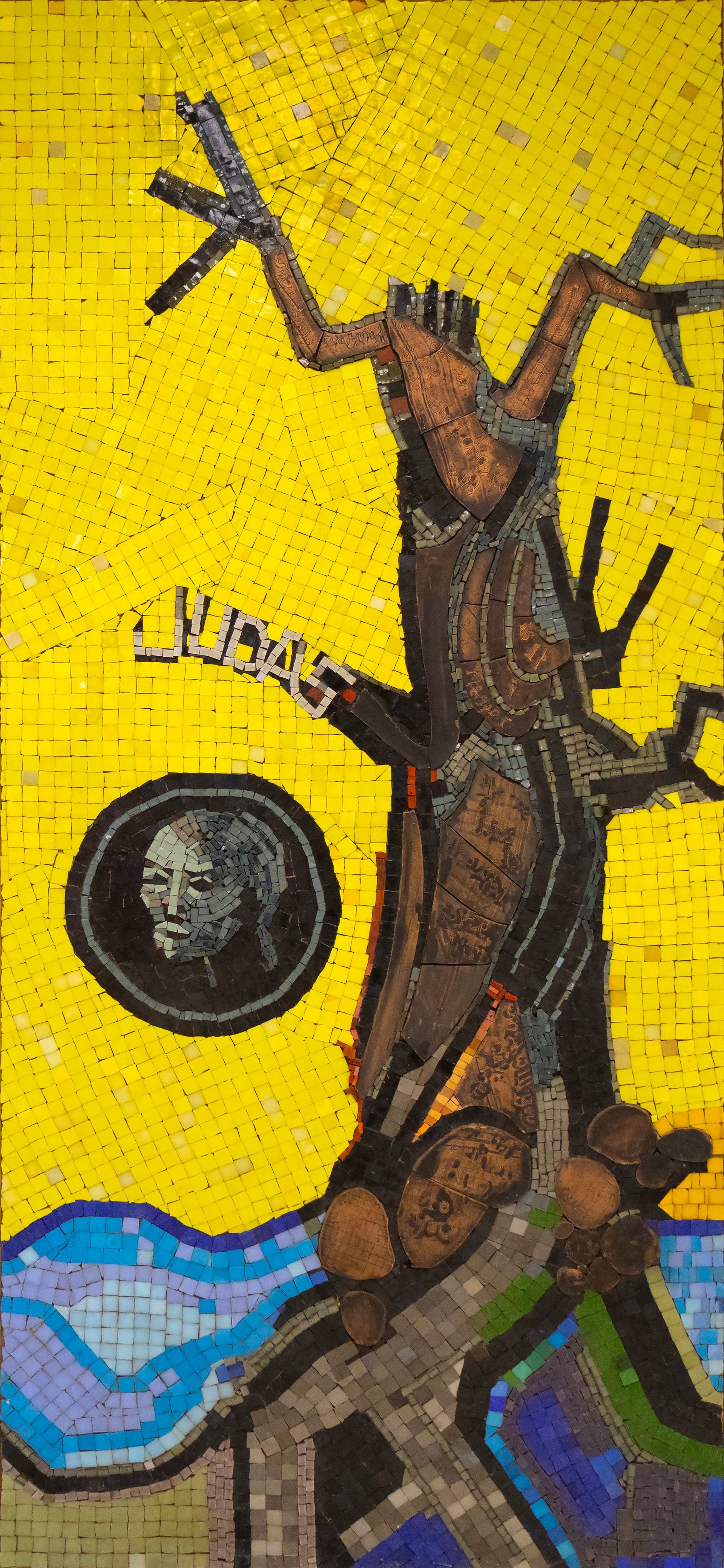 Mosaic of a tree with a figure in a circle and a yellow background.